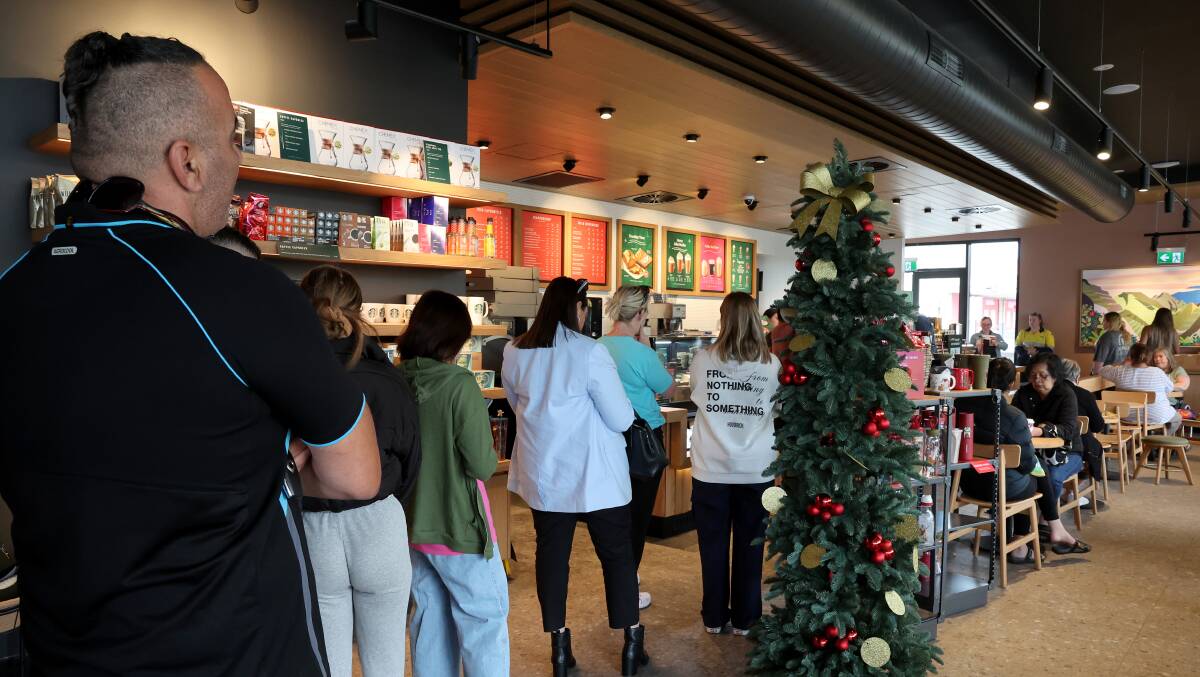 Customers line up to order at Starbucks in Warrawong on Monday, November 6. Picture by Sylvia Liber
