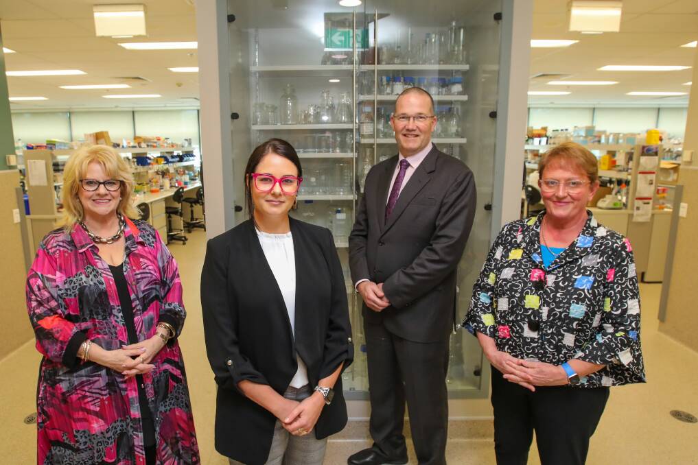 HELPING HAND: #VaxTheIllawarra's Vicki Tiegs, IHMRI researcher Dr Natalie Matosin, University of Wollongong deputy vice-chancellor Professor David Currow, and Illawarra Shoalhaven Local Health District chief executive Margot Mains. Picture: Wesley Lonergan