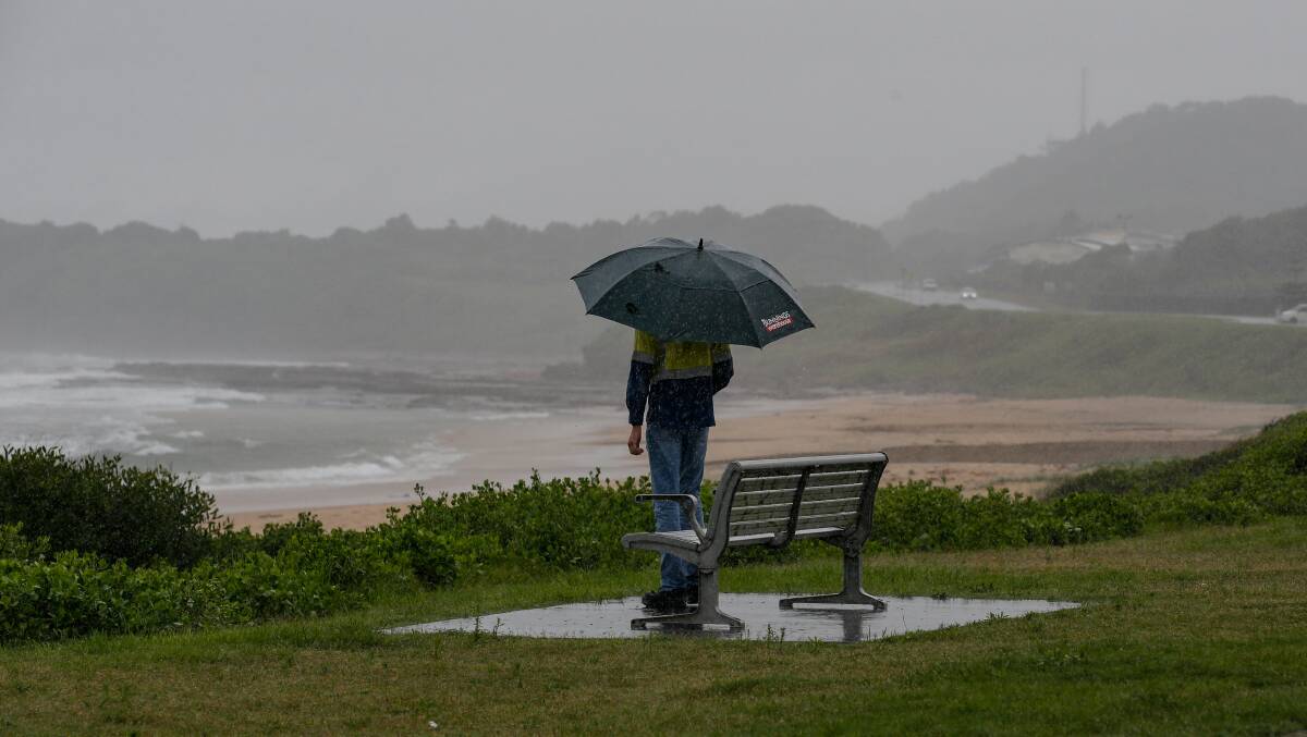 A man looks out over North Beach at Port Kembla. Picture: Anna Warr