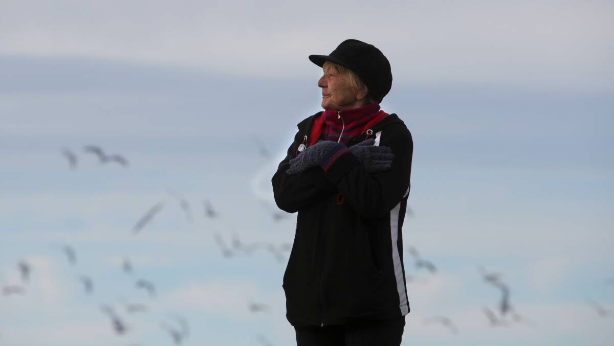 Angie Bendon rugs up against the cold at Lake Illawarra. Picture: Sylvia Liber