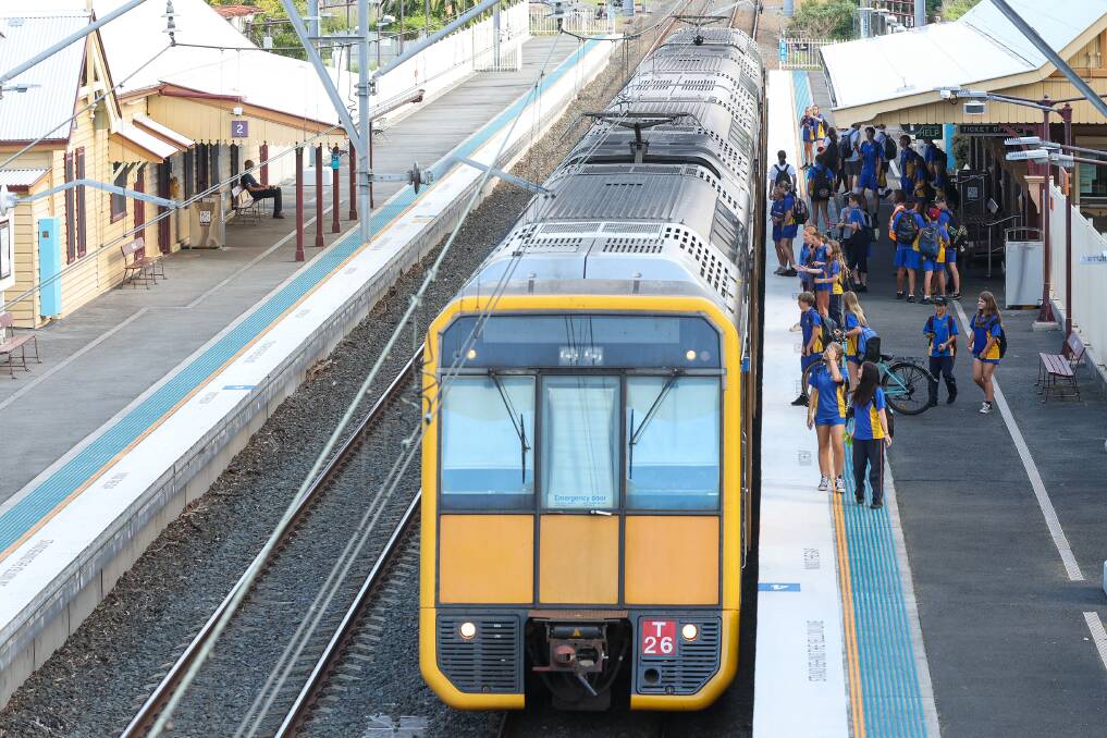 High school students wait to board a northbound train at Bulli Station. File picture by Adam McLean