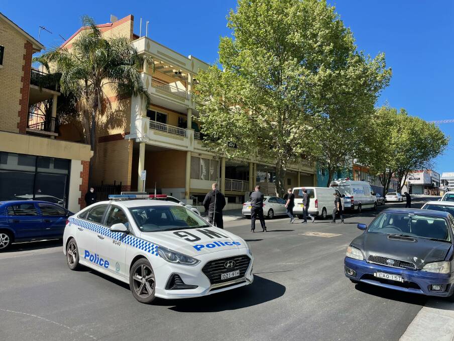 Police outside the Keira Street apartment block on Friday morning. Picture: Anna Warr