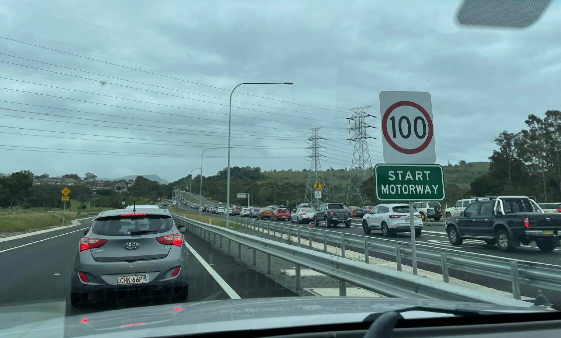 Traffic queues along the Princes Motorway due to a popular air show and a road closure at Windang on Sunday.