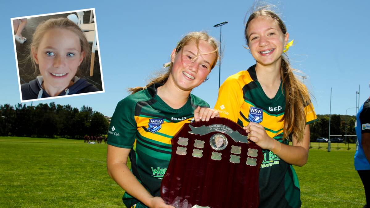 Kianda Davis and Zara Hughes hold the Shellharbour Shield, established in honour of their friend Emma Ryall (inset), who lost her life to suicide last year. Picture by Anna Warr.