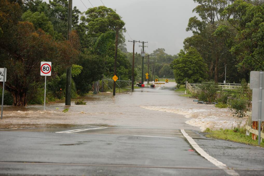 A flooded Darkes Road at Kembla Grange on Thursday. 