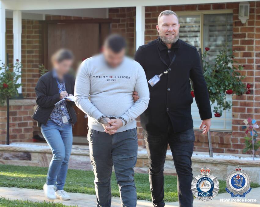 Detectives arrest a man in Picton as part of an investigation into the importation of drugs into NSW. Picture from NSW Police Force.