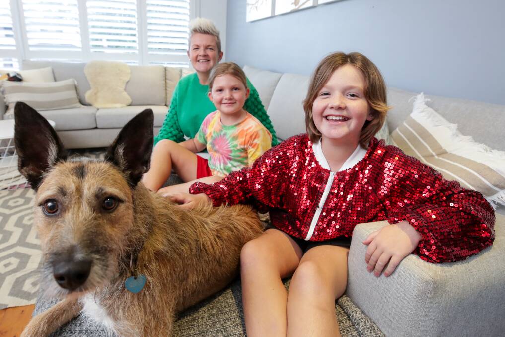 Charli Gerrey with her mum Faye, sister Chloe, 9, and dog Nellie. Picture: Adam McLean