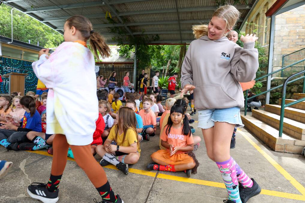 Students dance and show off their colourful socks. Picture by Adam McLean