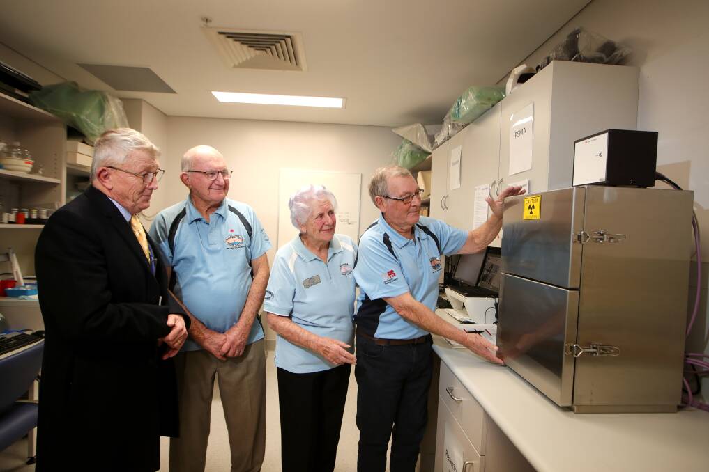 BENEFIT: Keith Wilson, Jean Fleming and Geoff Failes from Illawarra Cancer Carers with medical imaging district manager Peter Turner and the equipment. Picture: Sylvia Liber