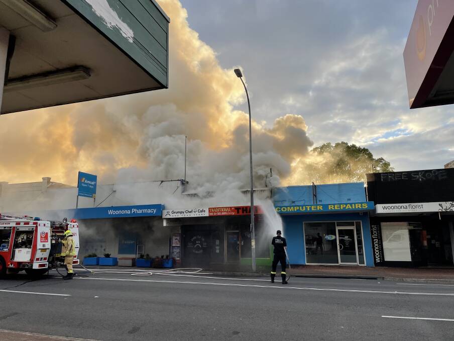 A firefighter at the scene of yesterday's blaze on the Princes Highway. Picture by Joel Farmer.
