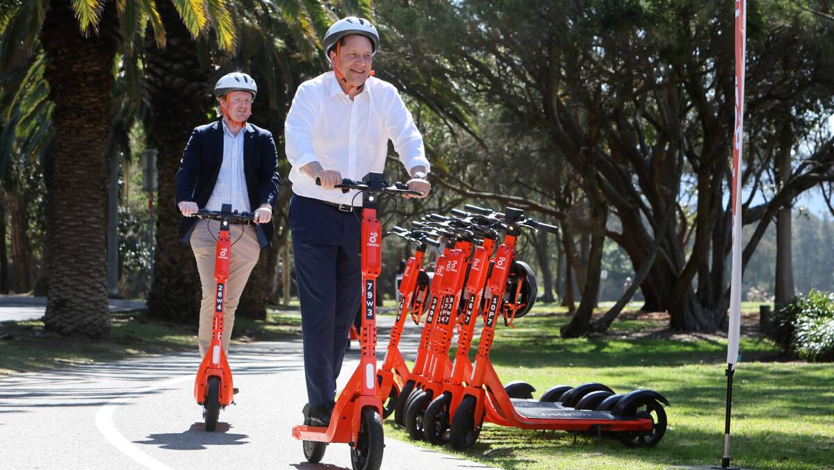 Paul Scully and Cr Cameron Walters ride the e-scooters. Picture by Sylvia Liber
