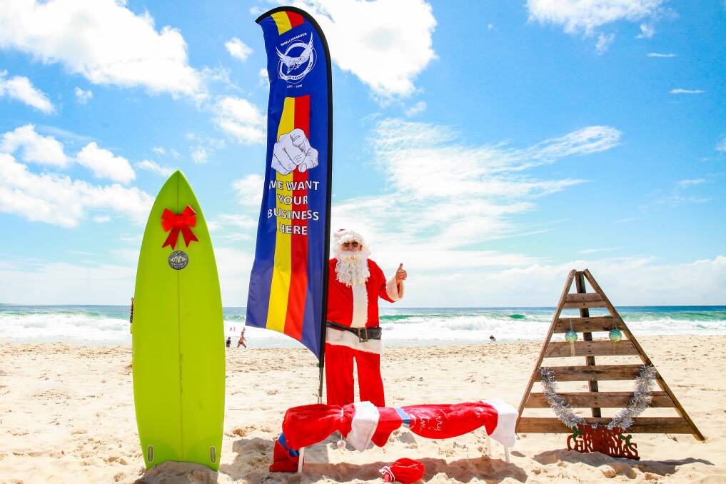FESTIVE: Santa - or Will Furney - embraces Christmas in Australia at Shellharbour. Picture: Jemma Colville