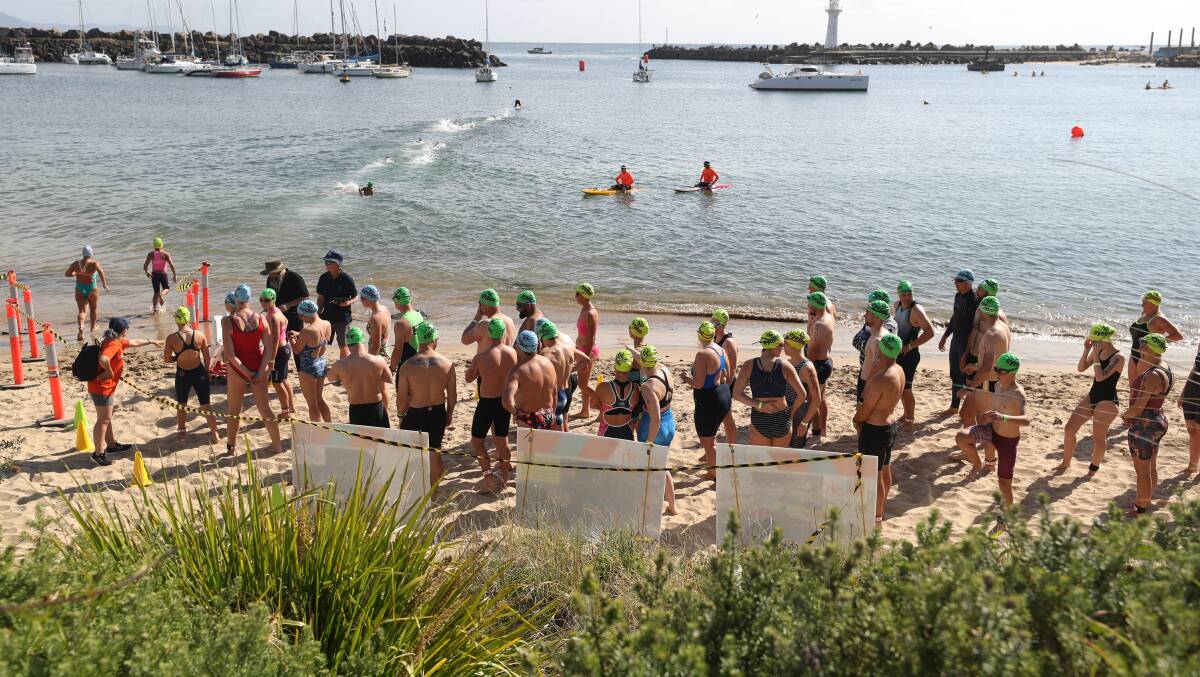 Competitors prepare to enter the water on Saturday morning. Picture by Robert Peet.