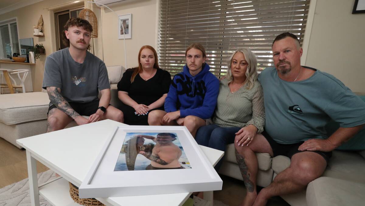 Brayden Chater's family - cousin Callum Young, sister Shayne, brother Harry, mum Stacey and dad Ralph - with a photograph of the 23-year-old. Picture by Robert Peet