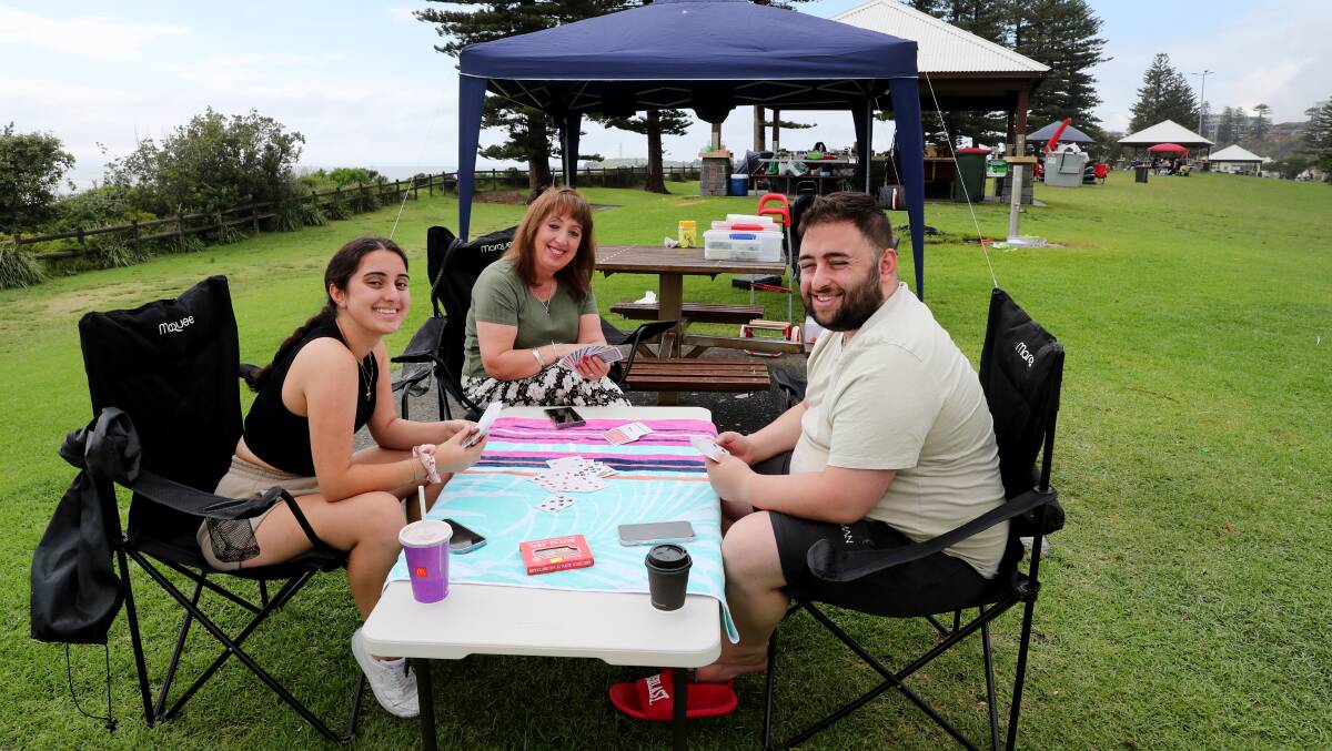 Shana Mikhael, Margaret Dawood and Stuart Mikhael enjoy a game of cards on a daytrip to Wollongong from Liverpool. Picture by Sylvia Liber