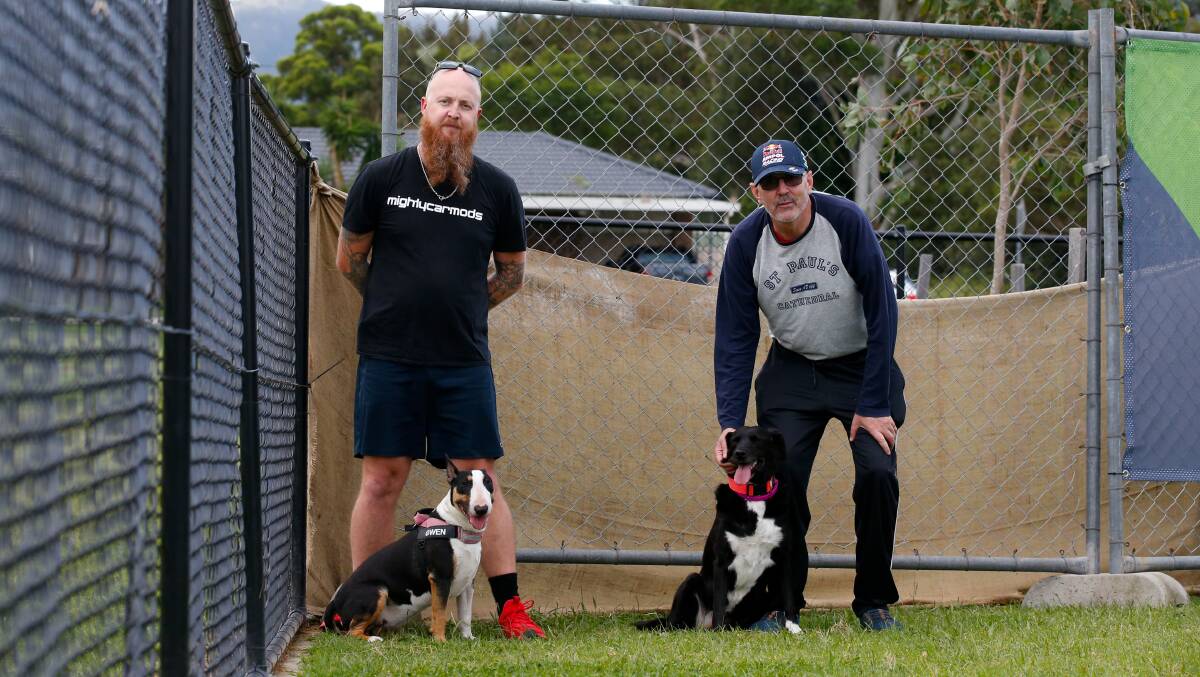 Luke Parker and Brad Hanns with dogs Gwen and Shadow in front of an area that has been fenced off to prevent dogs drinking stagnant water. Picture by Anna Warr.