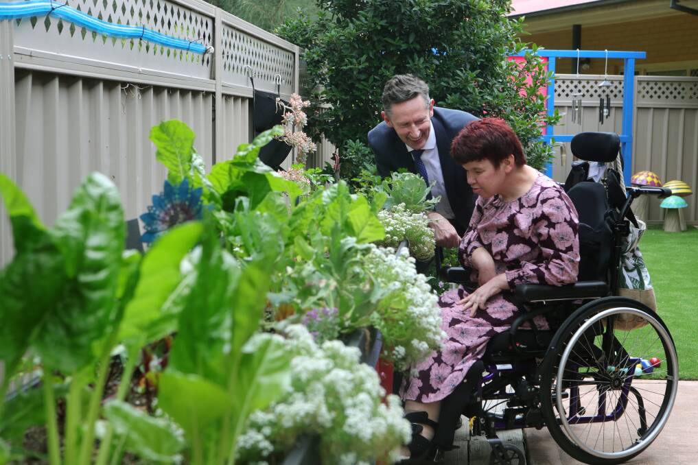 Cram Foundation participant Lisa Dale checks out part of the new sensory garden with Whitlam MP Stephen Jones. Picture: Sylvia Liber