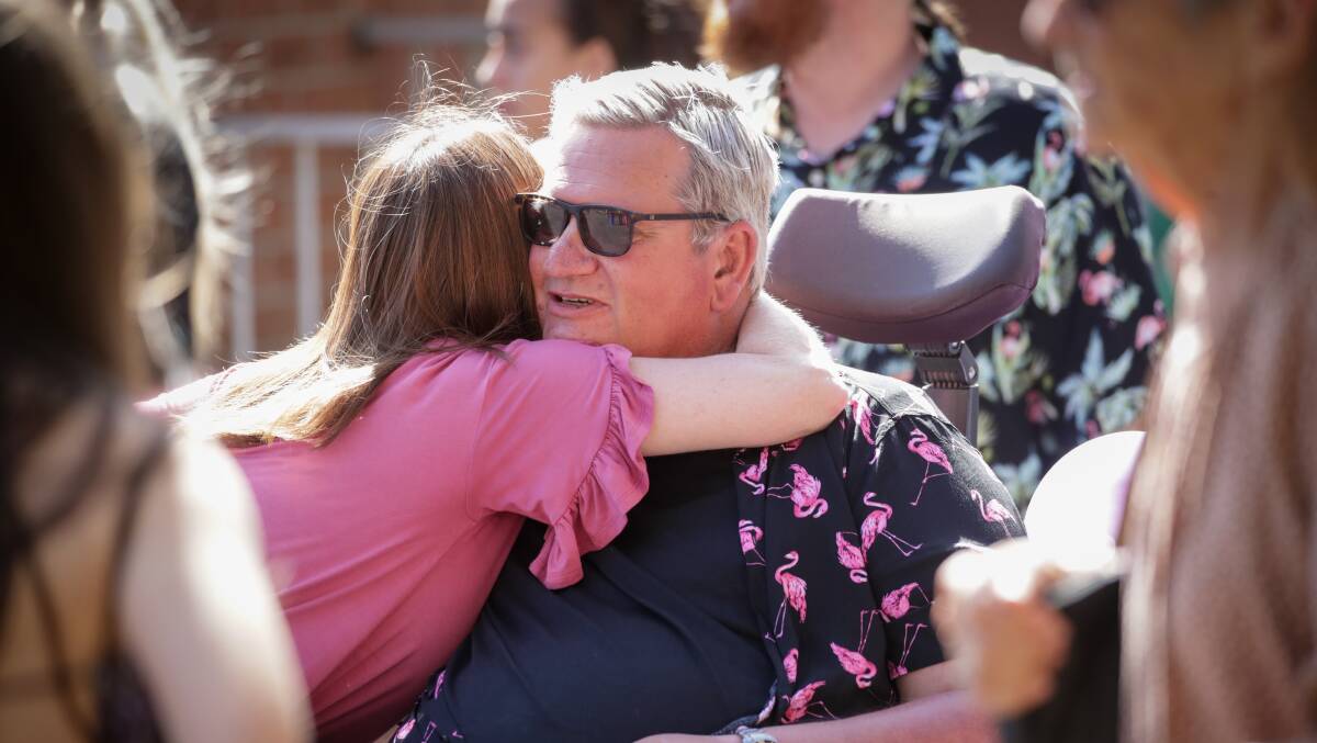 John Van De Putte greets a mourner at his daughter Lily's funeral in September 2022. Picture by Adam McLean
