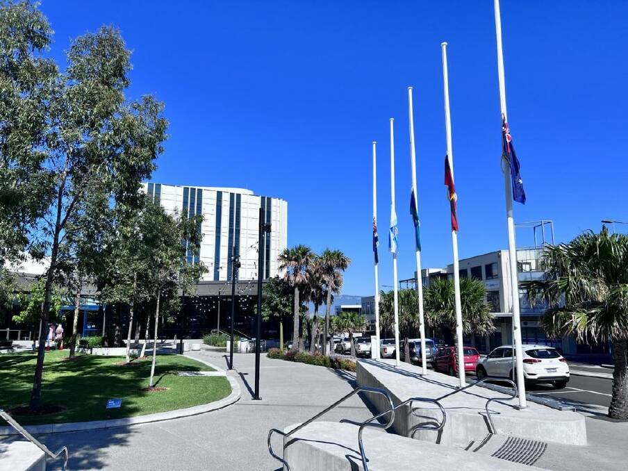 Flags flown at half-mast outside Shellharbour Civic Centre on Monday as a mark of respect for the victims. Picture from Shellharbour City Council