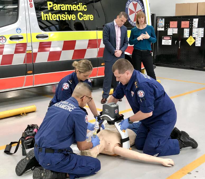 Paramedics demonstrate the LUCAS device as Ryan Park and Jo Haylen watch on. Picture from NSW Ambulance.