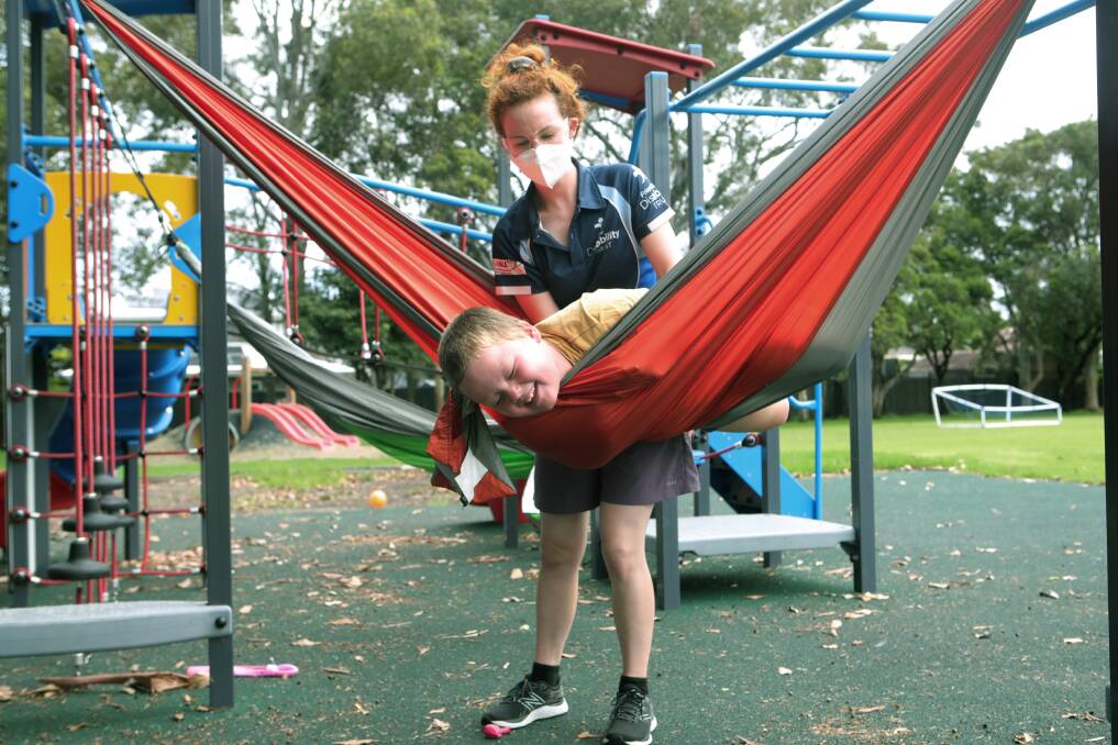 Darcy Sutton with carer Caitlin Fahey at a program run by the Disability Trust. Picture: Sylvia Liber