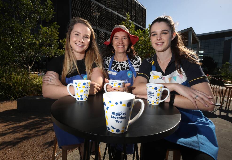 Tea time: Sally Lewis, Melaina Tate and Sari Boschiero at the fundraising event for Cancer Council at UOWs innovation campus. Picture: Robert Peet