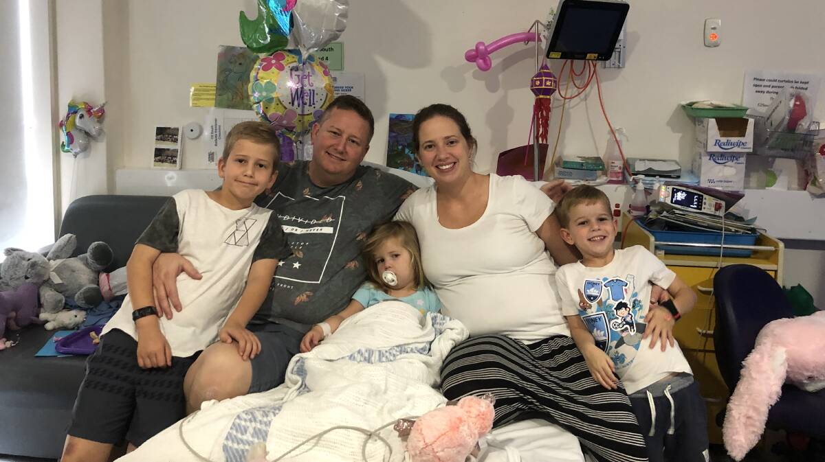 Rare condition: Horsley couple Jenny and Peter Northey with two-year-old daughter Ava and sons Luke, 7, and Liam, 5. Ava is recovering from a neurological disorder which struck without warning. Picture: Supplied