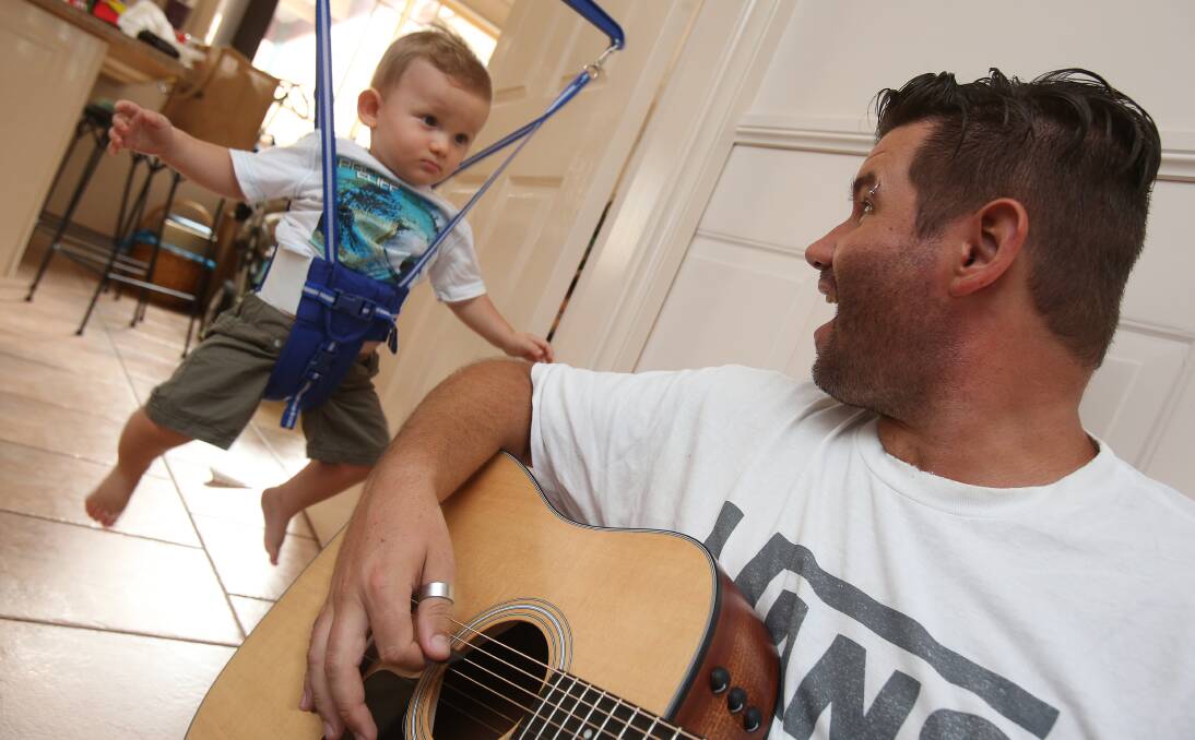 Lasting legacy: Stanwell Park's Breno Cowie with his son Ryan, 10 months. The grieving husband is using his love for his son - and his passion for music - to deal with the sudden loss of his wife Cat. Picture: Robert Peet