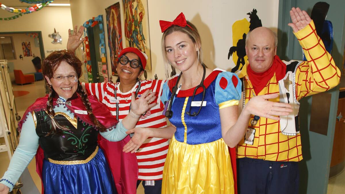 Dress up: Kids' ward staff Susie Piper, Susan Jacob, Jaimee Favelle and Kevin Walsh get into the spirit of Children's Party Week. Picture: Anna Warr
