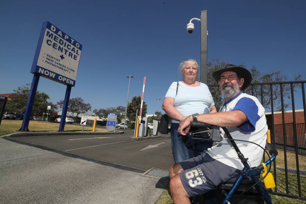 Dapto residents Margaret and Ray Potter have fought against the introduction of paid parking at the medical centre for several years. Picture: Robert Peet
