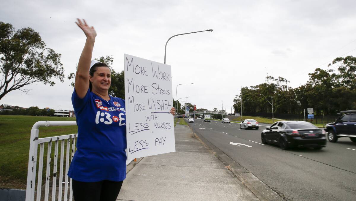 'More work, more stress, more unsafe with less nurses, less pay' reads nurse Silvana Dimoski's sign. Picture: Anna Warr