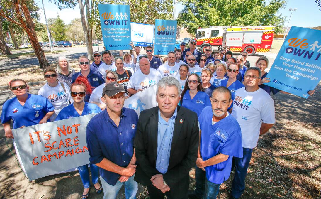 Show of support: Fire Brigade Employees Union's Darin Sullivan, South Coast Labour Council secretary Arthur Rorris and NSWNMA representative Glenn Hayes front a protest at Shellharbour Hospital. Picture: Adam McLean