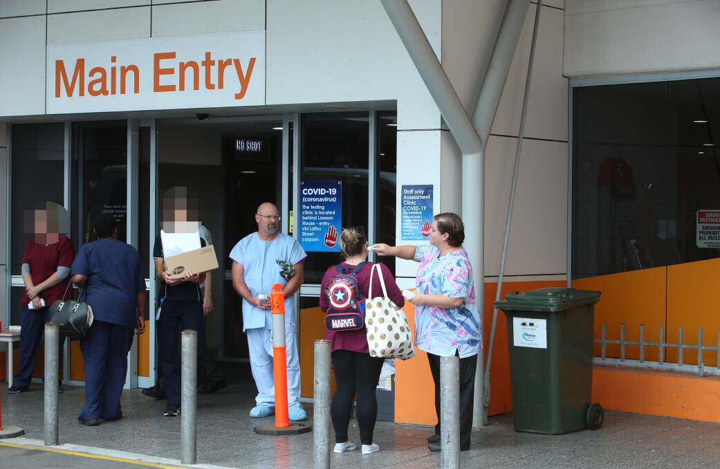 Extra measures have been taken at Wollongong Hospital to reduce the spread of infection - including testing temperatures of patients, visitors and staff at the main entry. Picture: Sylvia Liber