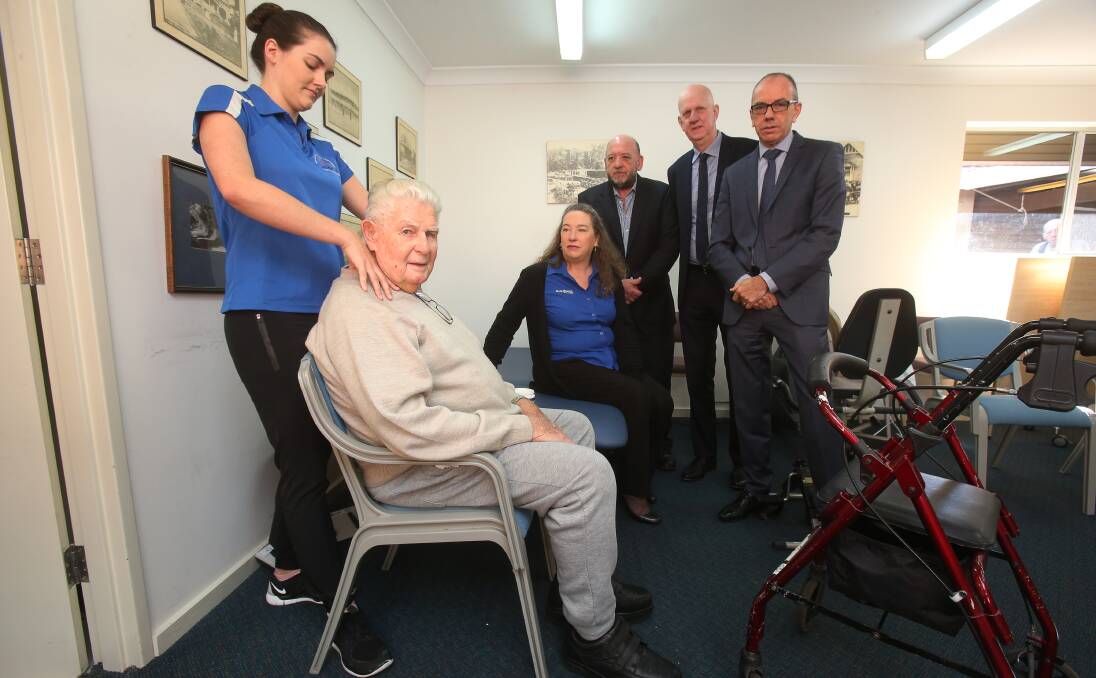 Crisis in care: Physiotherapist Karly Coltman with Illawarra Diggers resident Clem Selway and the CEOs of four Illawarra aged care providers: Clare Rogers, Peter Whittall, Don Ross and Mark Sewell. Picture: Robert Peet