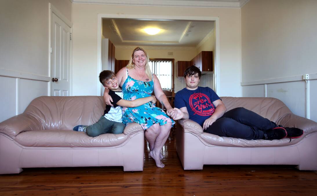 Home at last: Housing Trust tenant Leasha Valentiner with sons Joshua, 11, and Sean, 16, who have a new home in time for Christmas. “If it can give someone else hope, then I am happy to share my story”. Picture: Sylvia Liber