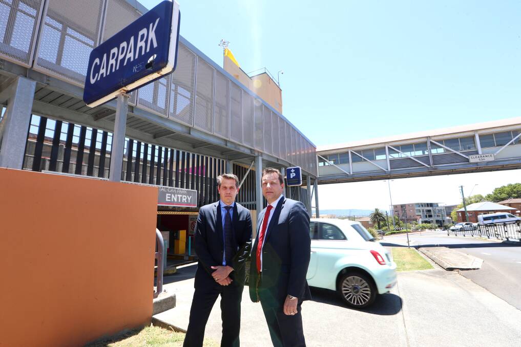 Pay as you go: Keira MP Ryan Park and Wollongong MP Paul Scully at Wollongong Hospital's paid parking facility. Picture: Sylvia Liber