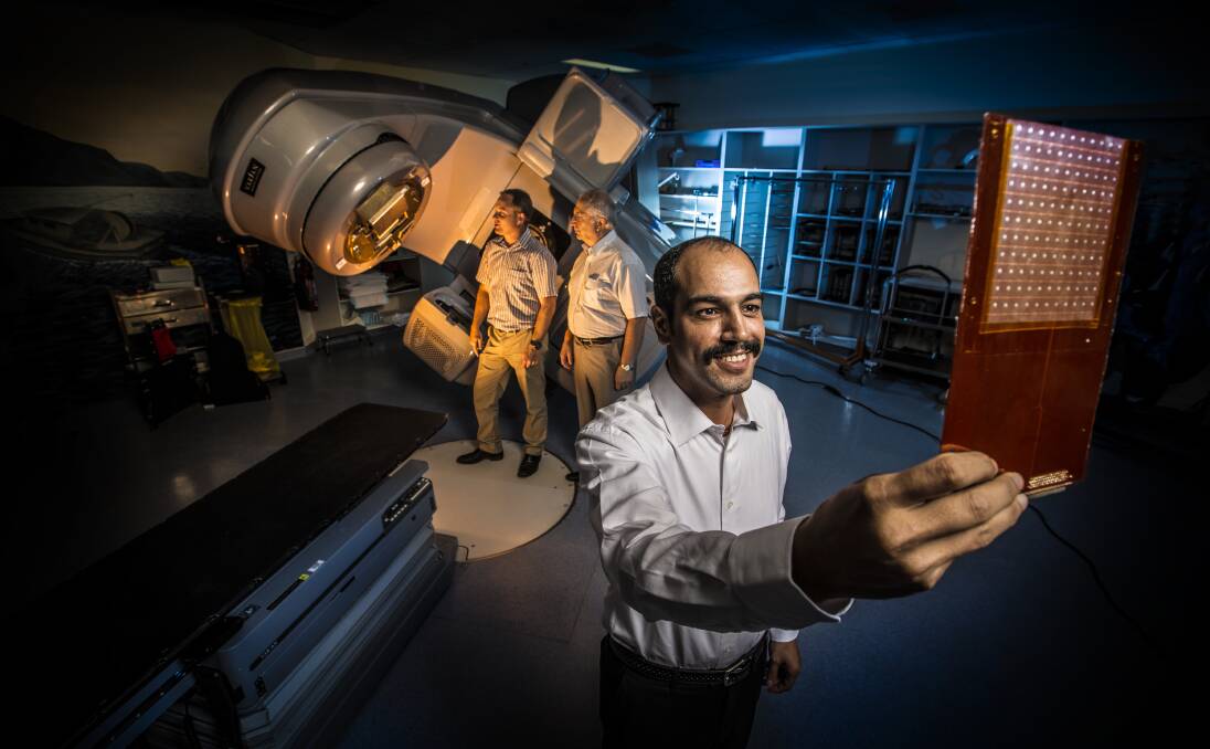 On target: Ziyad Alrowaili - with Associate Professor Michael Lerch and Professor Anatoly Rozenfeld from UOW’s Centre for Medical Radiation Physics - with the 'magic' radiation detector. Picture: Paul Jones