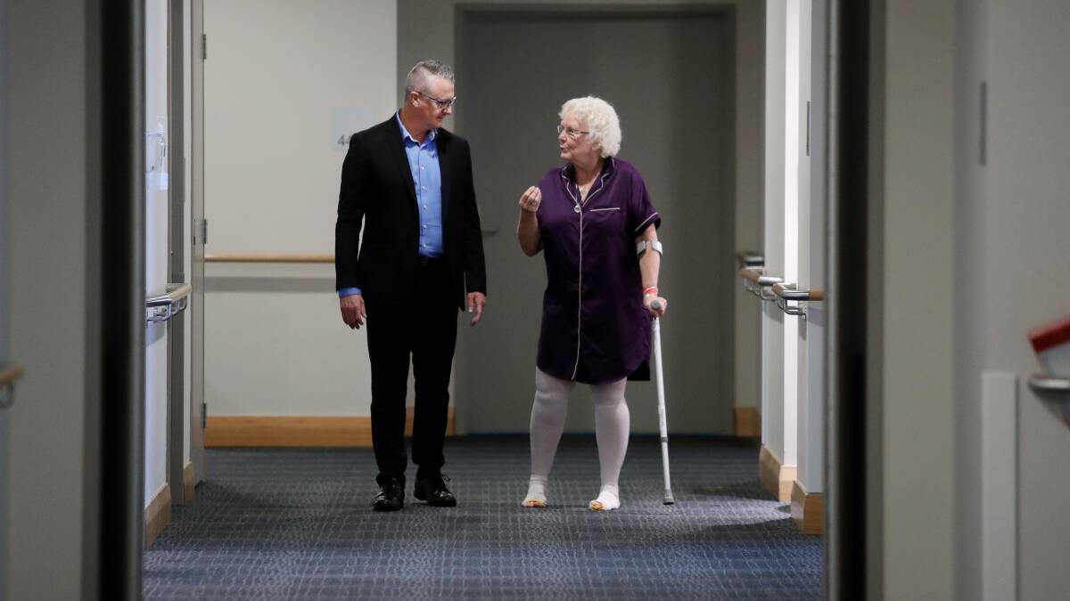 Worth the wait: Suellen Brockwell, pictured with Wollongong Hospital CEO David Crowe, has finally had her hip replacement. Picture: Robert Peet