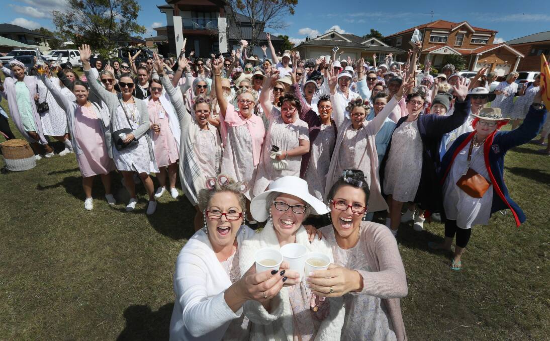 Ali Waters (centre) with Shell Cove Wine Tour organisers Cassy Peters and Carlie Page-Quinn - and the other lovely ladies taking part in the event on Saturday. Picture: Robert Peet