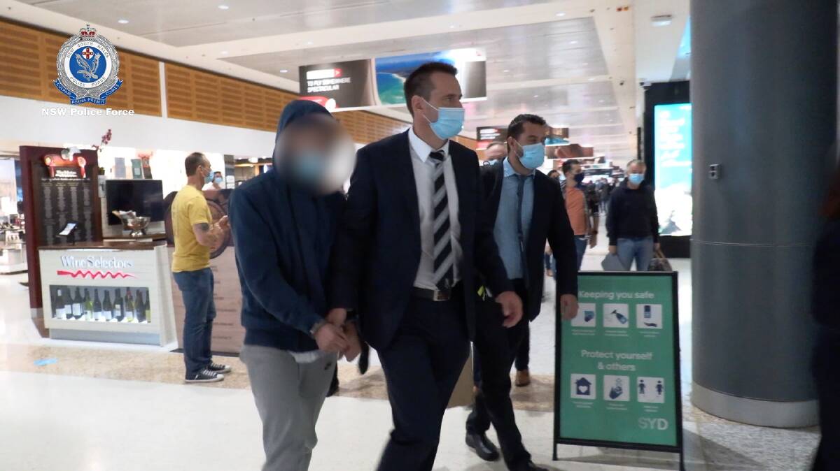 The men were escorted back to Sydney on Friday and taken to Surry Hills Police Station. Pictures: NSW Police