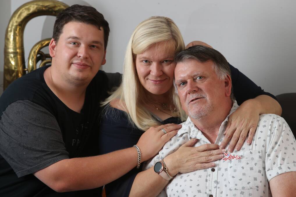 Close bond: Bruce Fenwick with wife Cindy and son Ash, who followed a Triple Zero call taker's instructions to keep him alive till paramedics arrived. Picture: Robert Peet