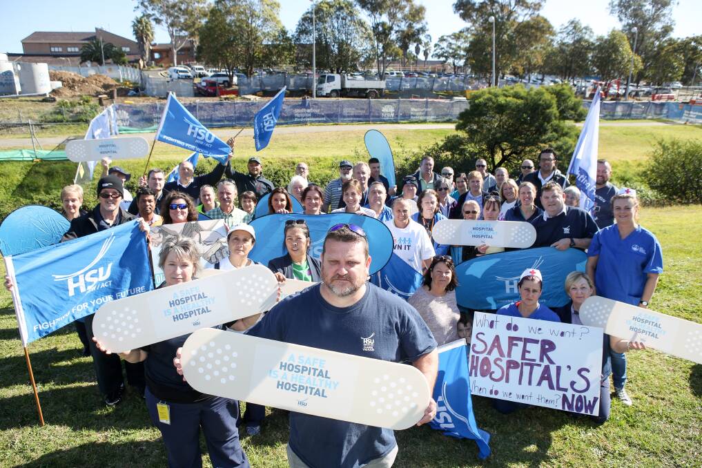 Action needed: Shellharbour Hospital staff called for more security guards, with enhanced powers and better training. HSU Shellharbour branch president Michael Twyford (centre) said assaults on staff were increasing.
