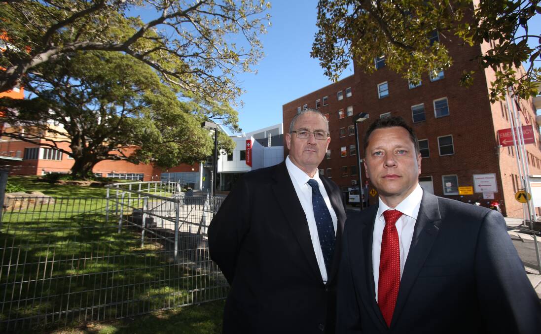 Waits worsen: NSW Opposition health spokesman Walt Secord with Labor candidate for Wollongong Paul Scully outside Wollongong Hospital on Tuesday to voice concerns over surgery waiting lists. Picture: Robert Peet