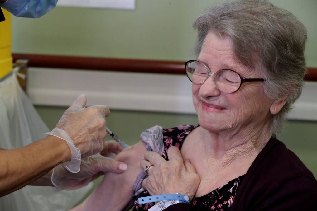 IRT Woonona resident Elizabeth Gunter said after the "first nip" of the needle she was fine. At 85, she said she'd be "silly" not to get the COVID vaccine. Pictures: Robert Peet