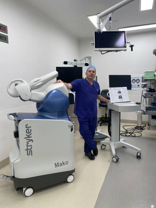 Cutting edge: South Coast orthopedic surgeon Dr Paul Jarman with the new MAKO robot for joint replacements at Wollongong Private Hospital. Picture: Supplied