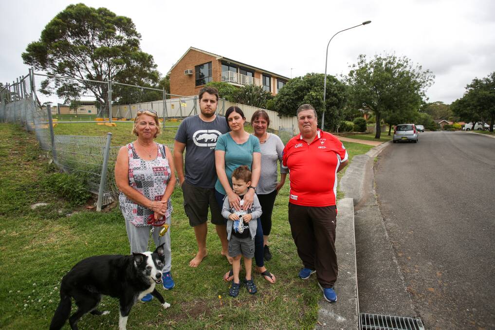Concerns: Tarra Crescent residents Karin Tilden, Simon, Mel and Noah, Sue Knox and Peter Tilden are worried the street's rarely-used access point to Shellharbour Hospital will become a major thoroughfare during its long redevelopment. Picture: Adam McLean