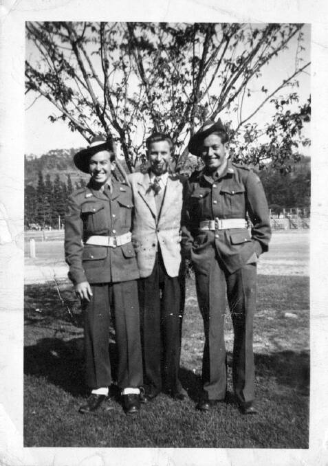 Private Lucas, pictured left, with colleagues in Japan.