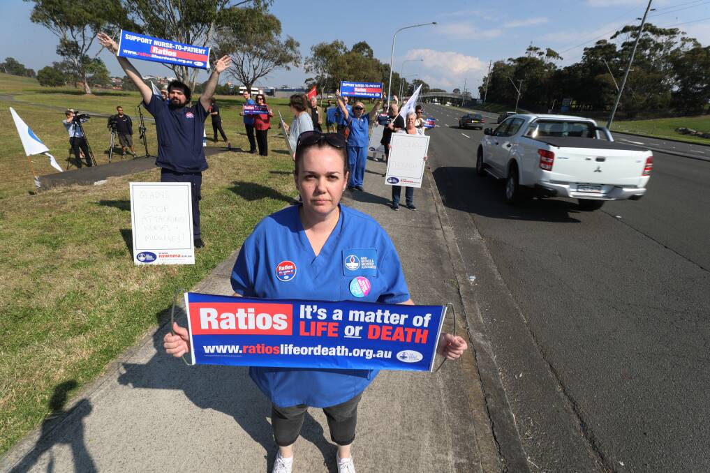 NSWNMA Illawarra representative Katrina Bough joins colleagues and community members outside Shellharbour Hospital at a midday rally. Picture: Robert Peet