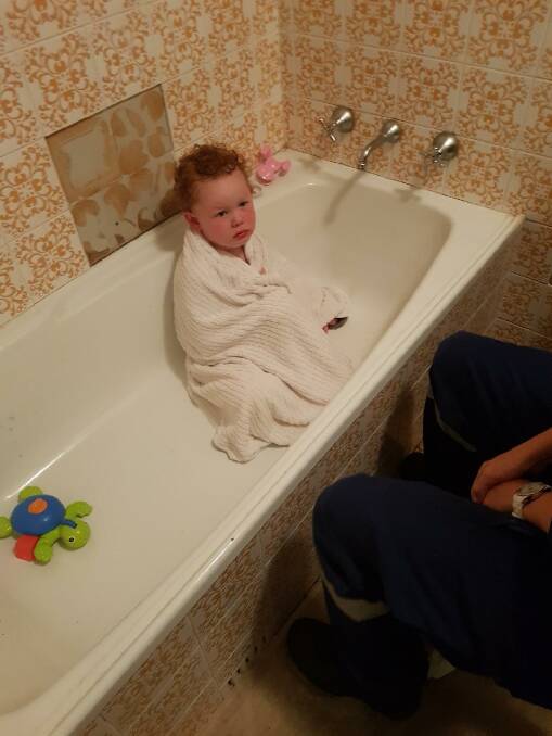 Stuck in the tub: The three-year-old was eventually released without injury, after police rescue officers cut the plughole away from his fingers.