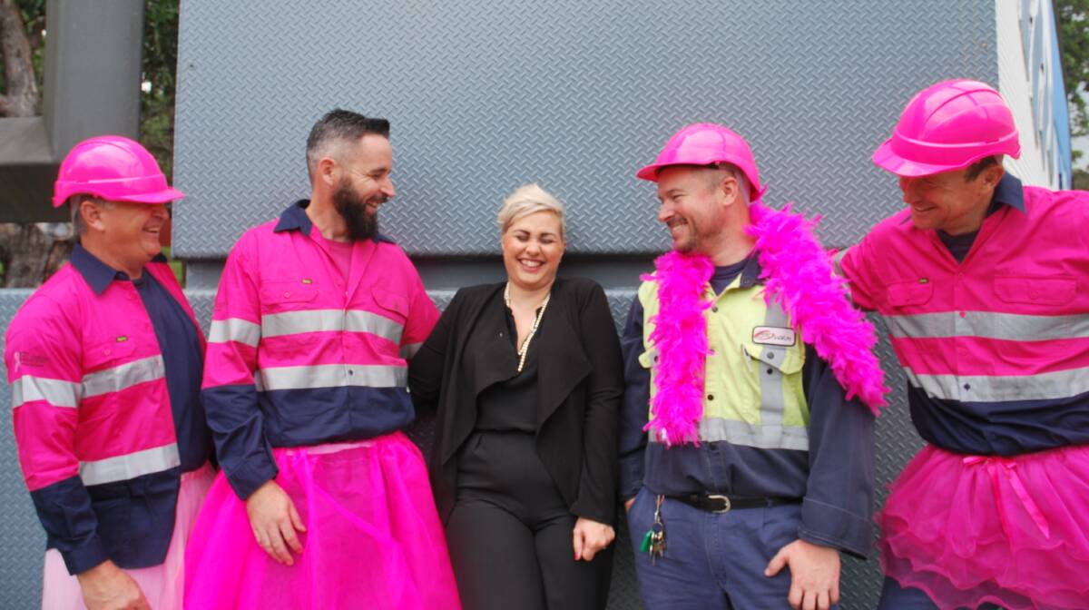 Raising awareness: Bluescope Steel workers Paul Flemming, Sam Thompson, Rob Giles and Ross Schuback with Sarah Thompson who has battled breast cancer. Picture: Supplied